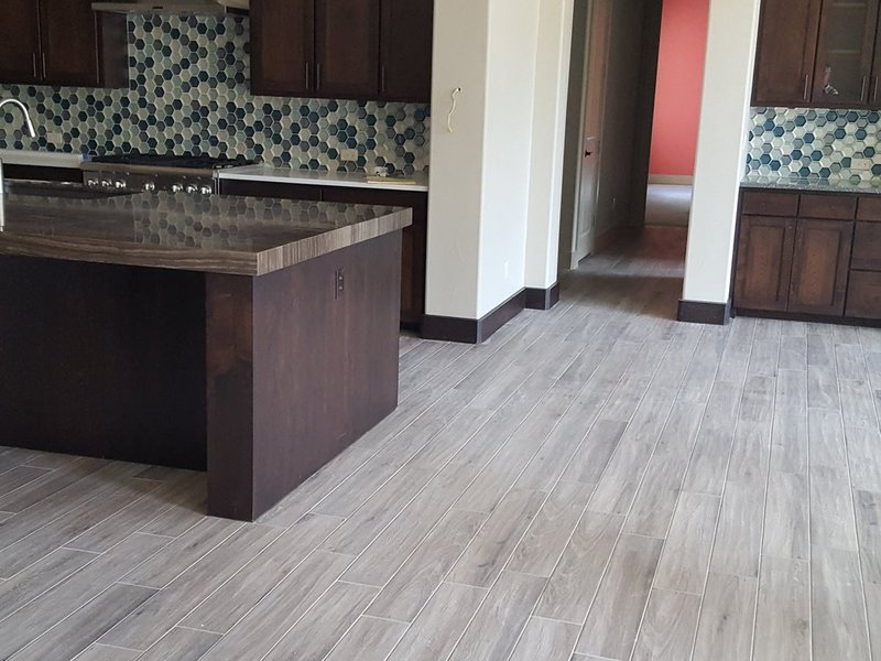 gray laminate floor by Green Carpet Co. - The Flooring Connection in San Antonio, TX